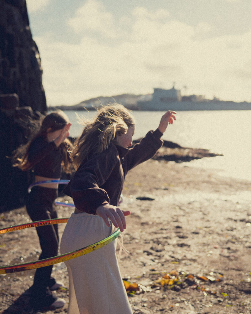 Photo of sisters playing in Flushing Cornwall