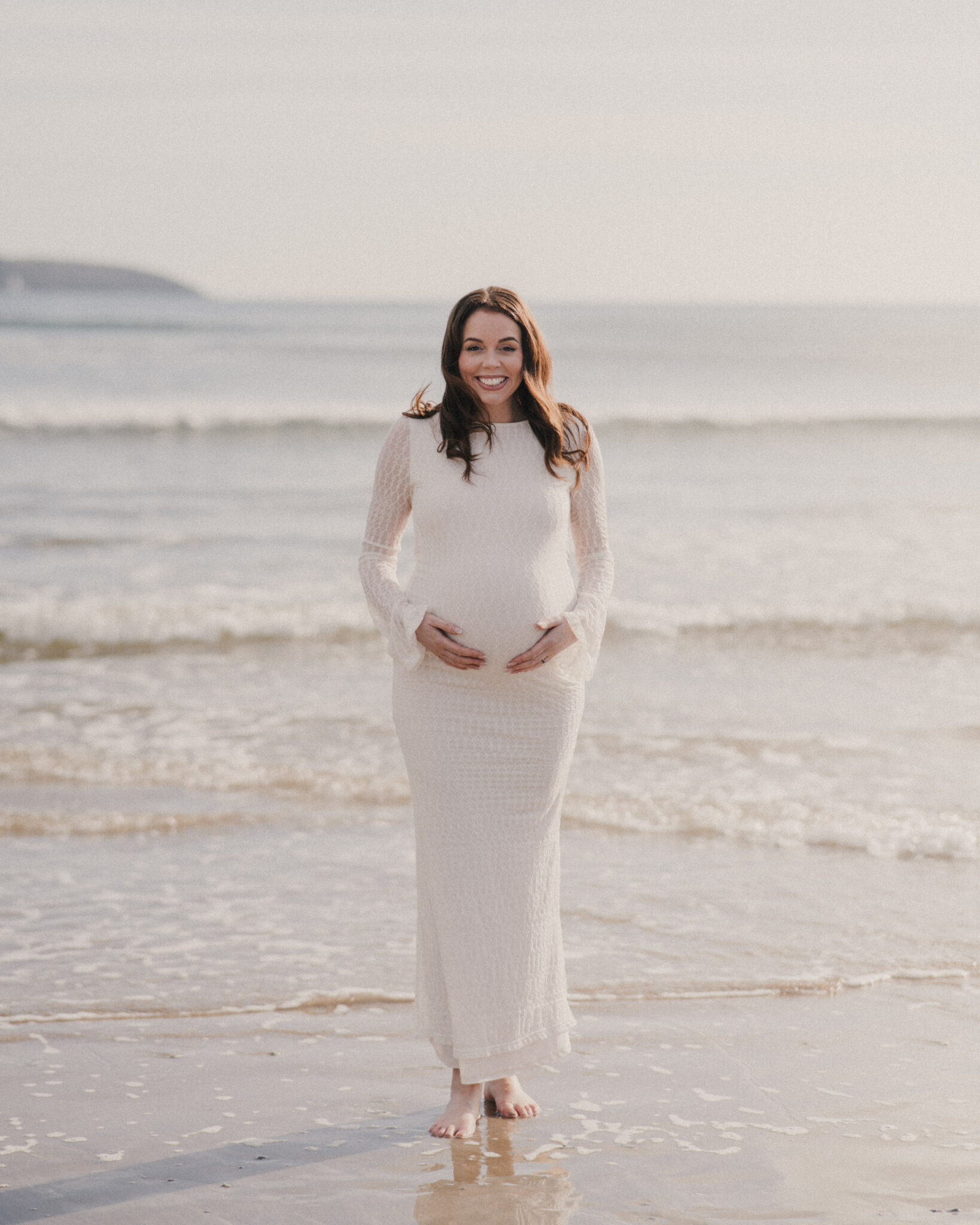 Photo of a pregnant mother on beach in Cornwall