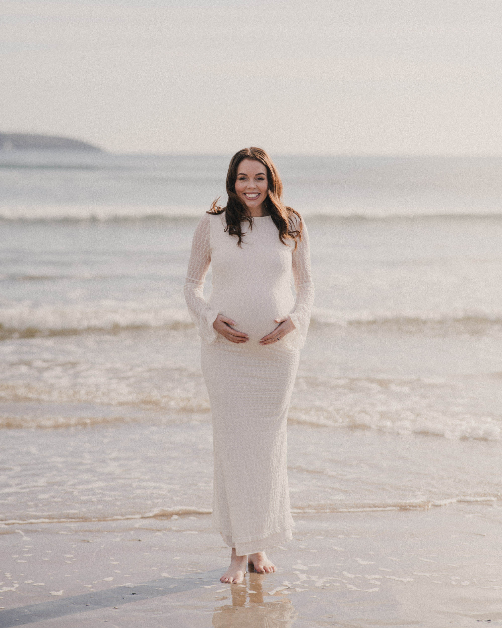Photo of a pregnant mother on beach in Cornwall