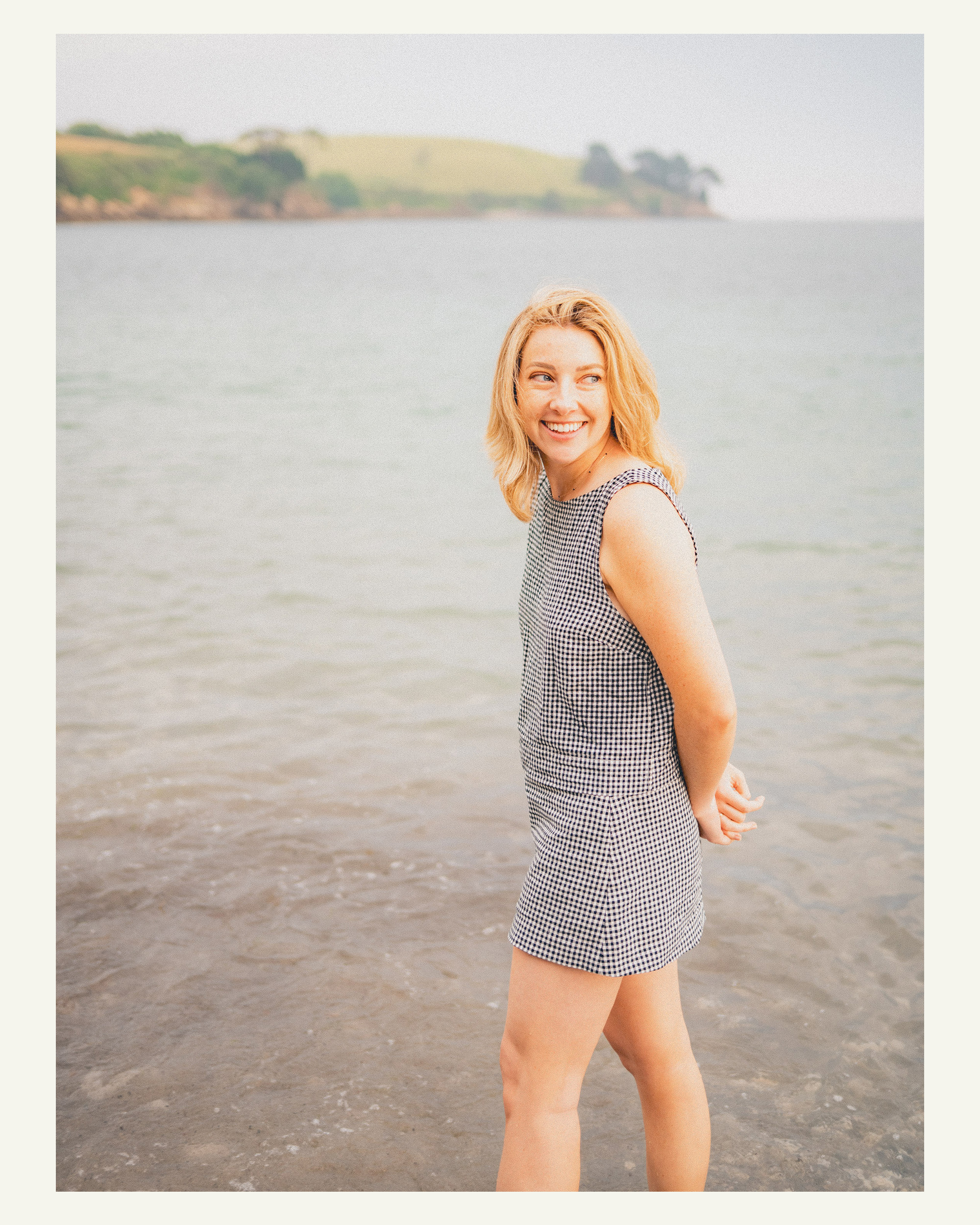 Woman smiling beside the Helford River during a family holiday photoshoot near Falmouth
