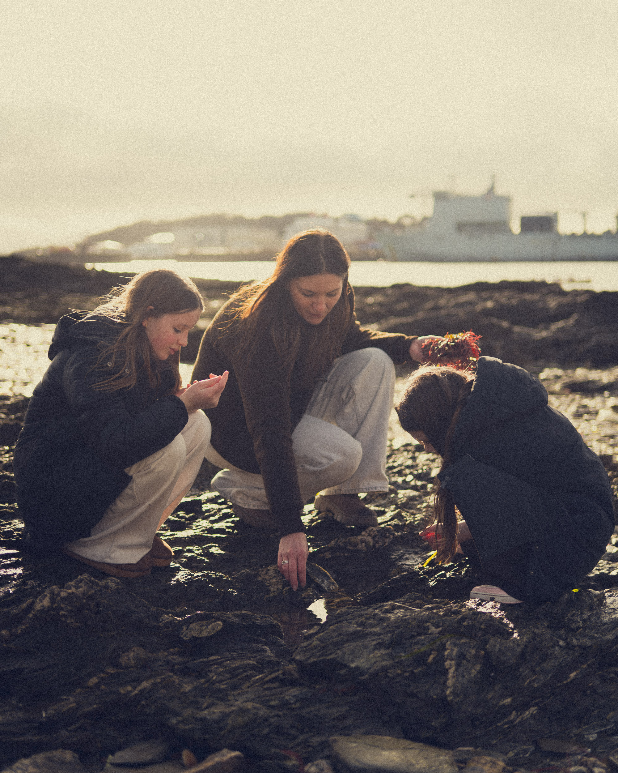Mother and daughters photographed at Flushing Beach near Falmouth