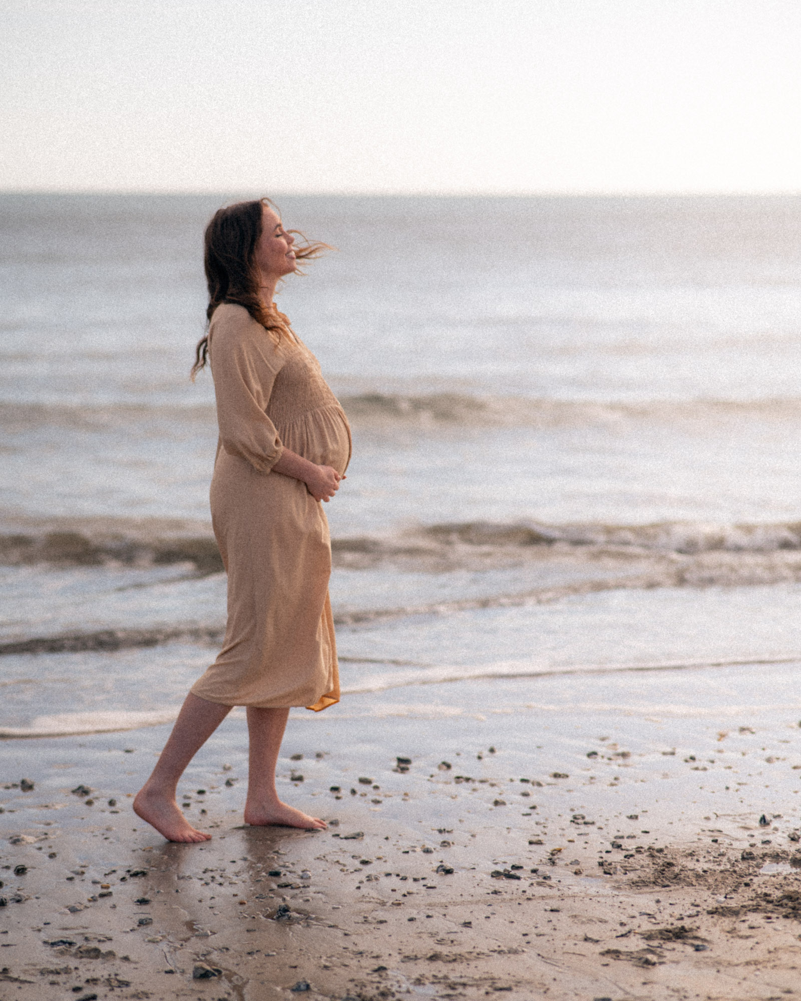 Mother photographed during a maternity session in Cornwall