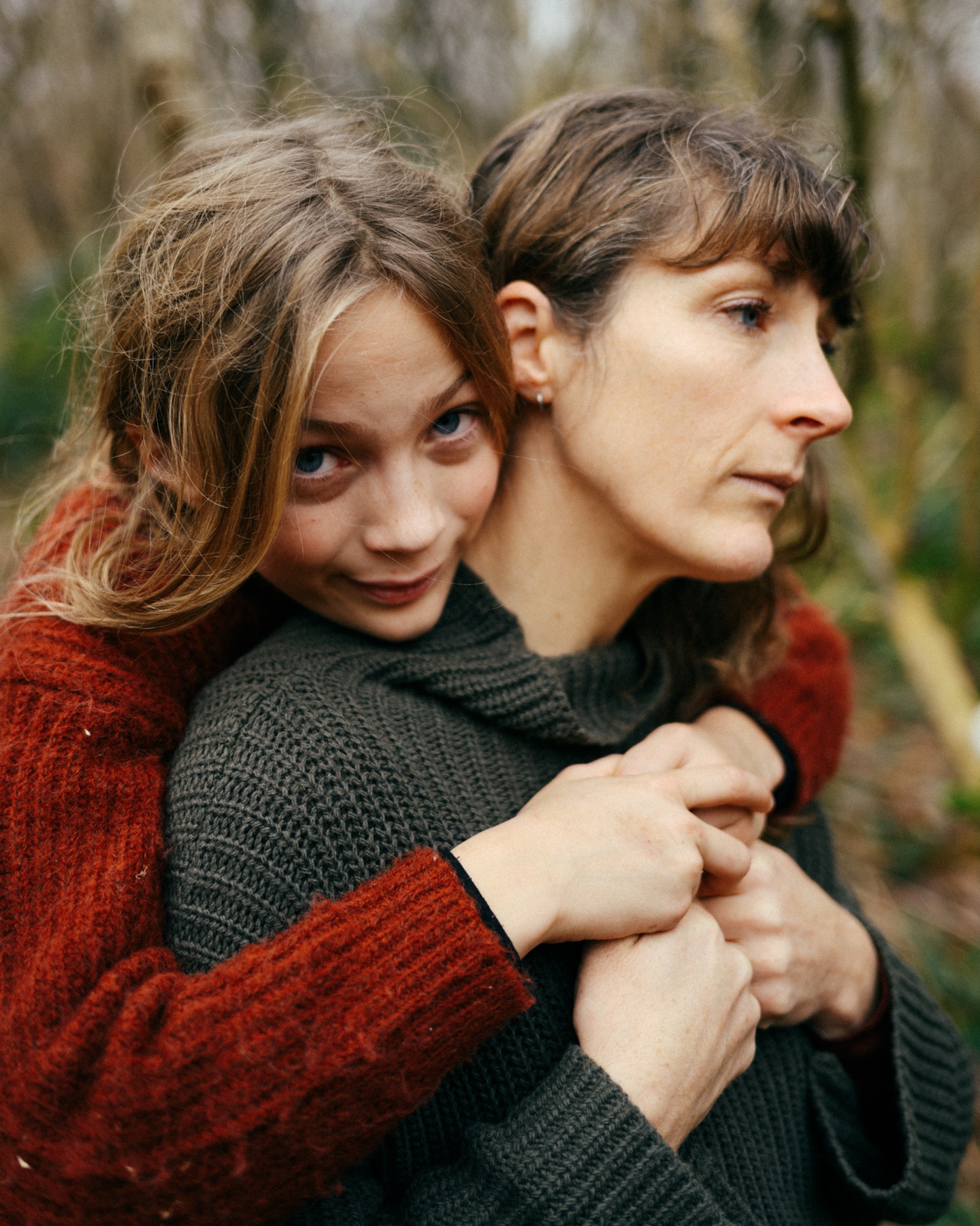 Annie and a child sharing a hug at Godolphin House