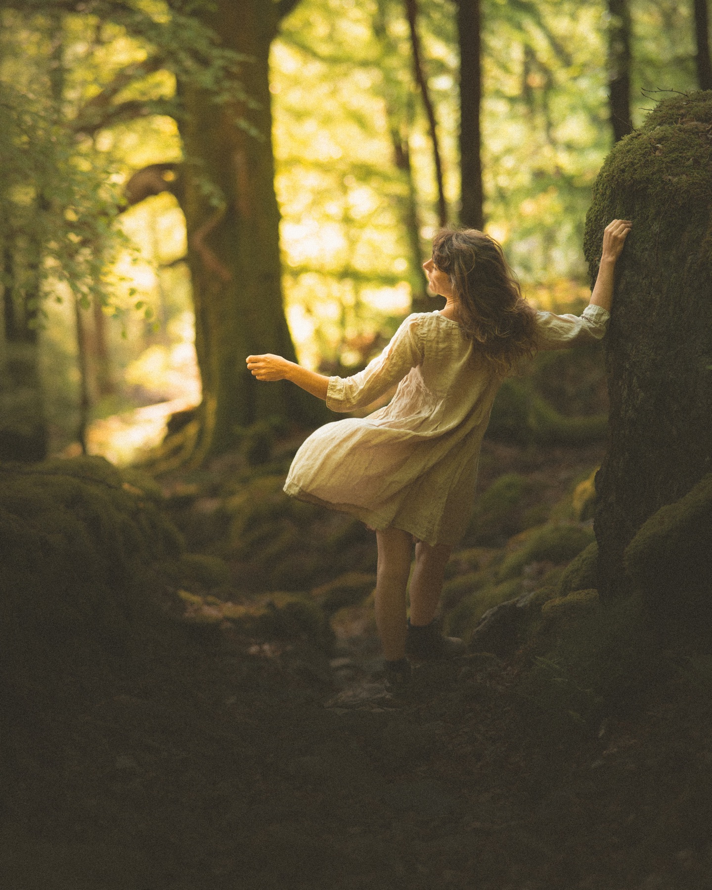 Annie walking through woodland in Wales