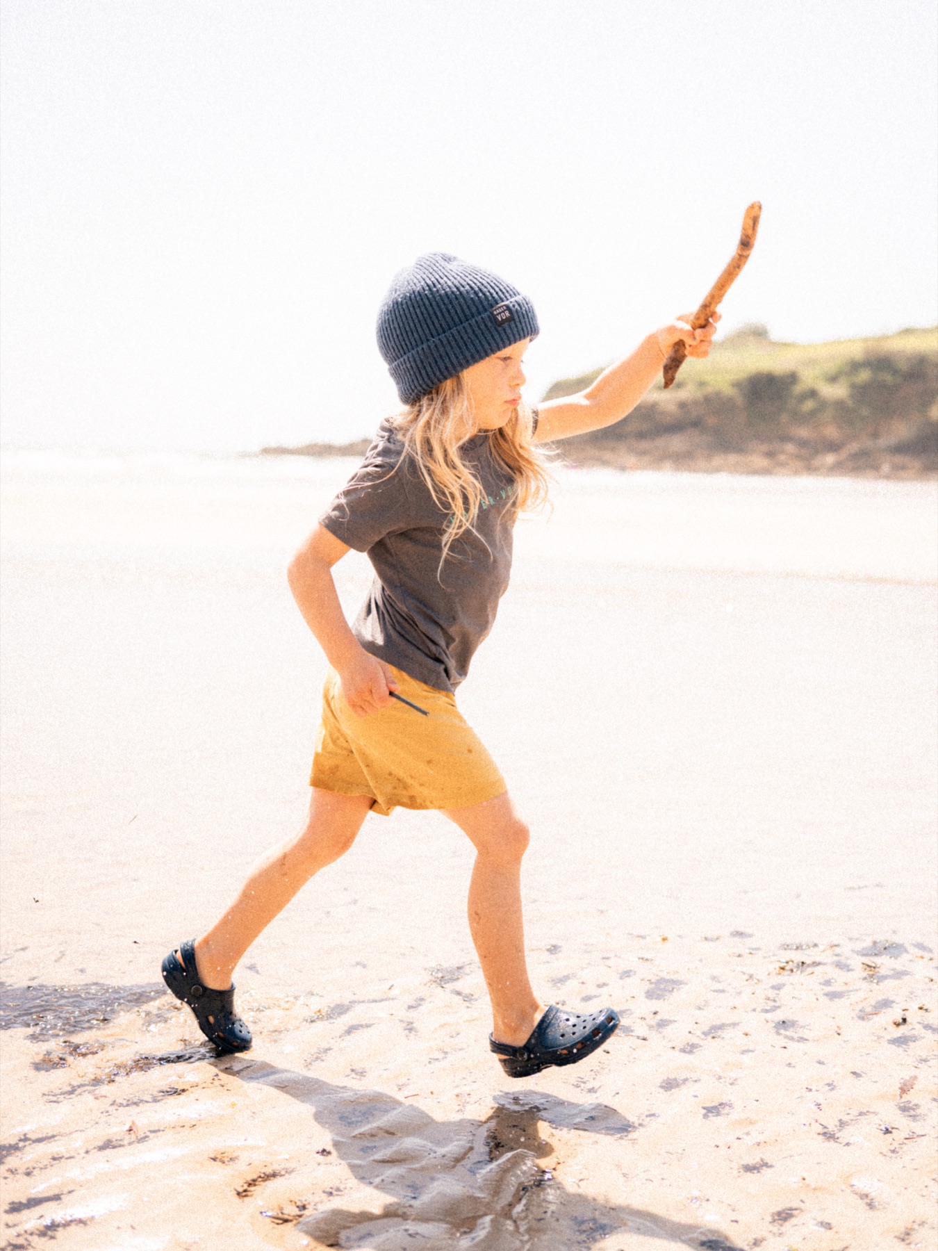 A child exploring Maenporth beach